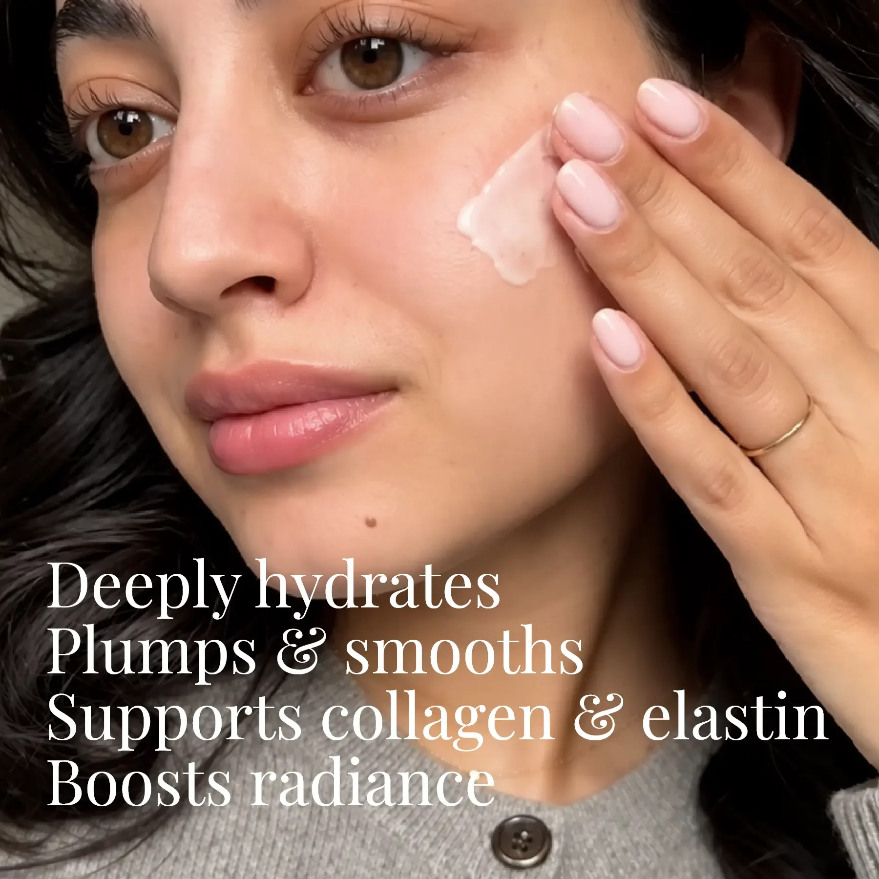 Seabody Glycan Enrich Moisturiser Woman holding Seabody Glycan Enrich Moisturiser near her face