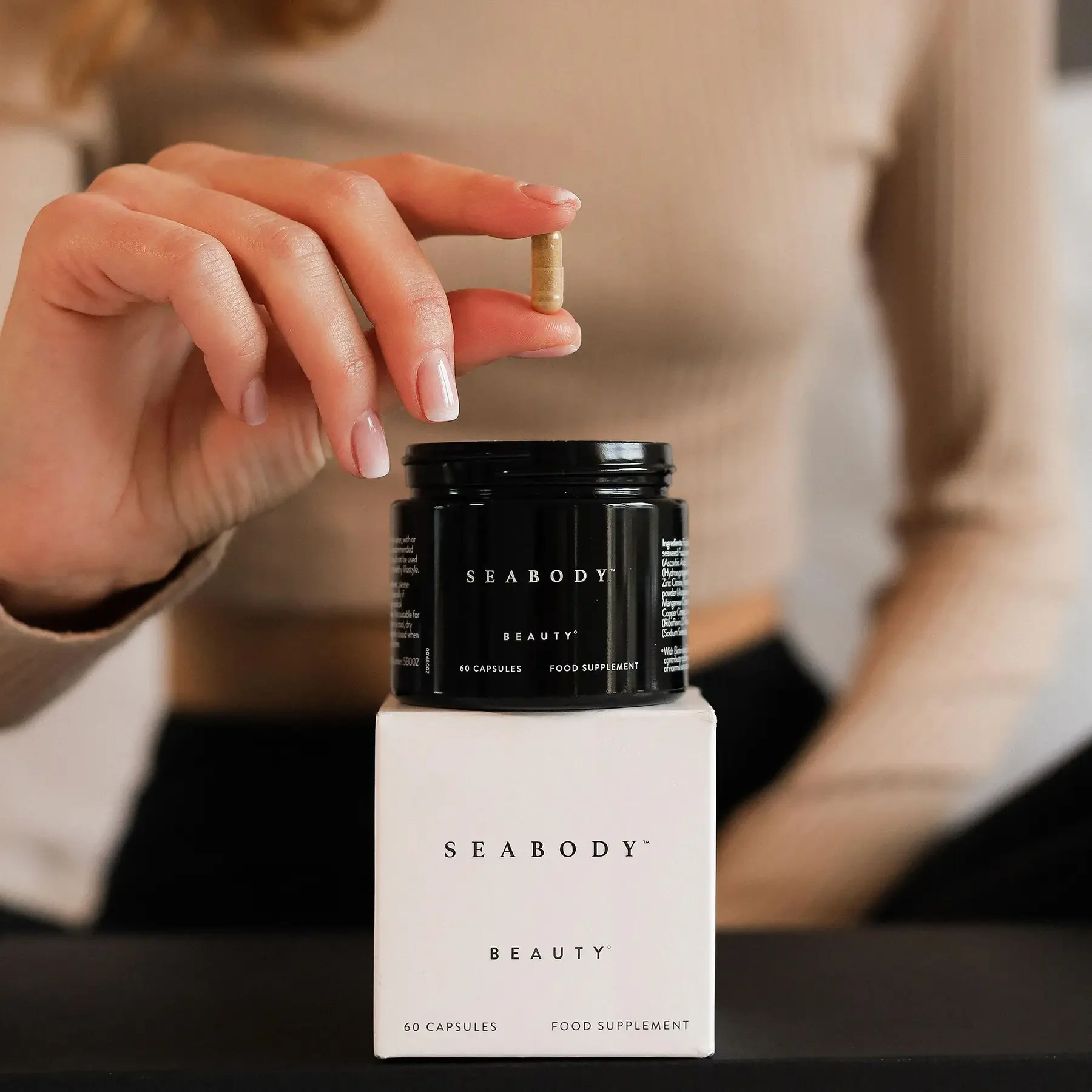 Beauty capsule in hand Beauty capsule in hand