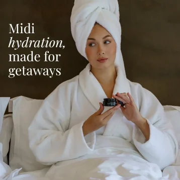 Womwn on bed using Seabody Glycan Enrich Moisturiser MIDI Size, ideal for getaways
